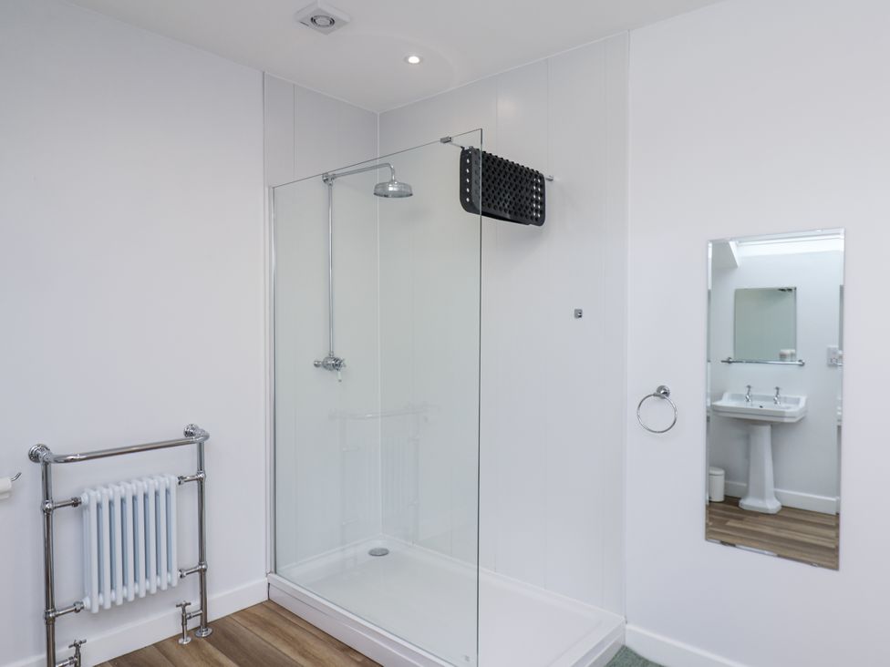 A bathroom with a shower and sink at 96 Church Street in Guisborough