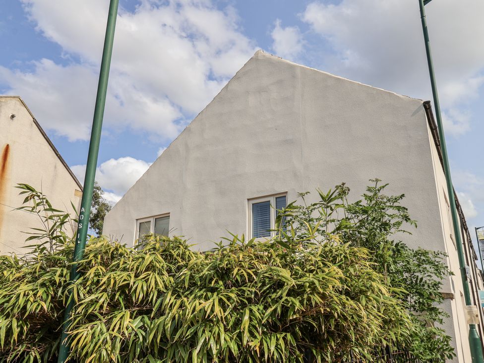 A building with a window and plants outside at 96 Church Street in Guisborough