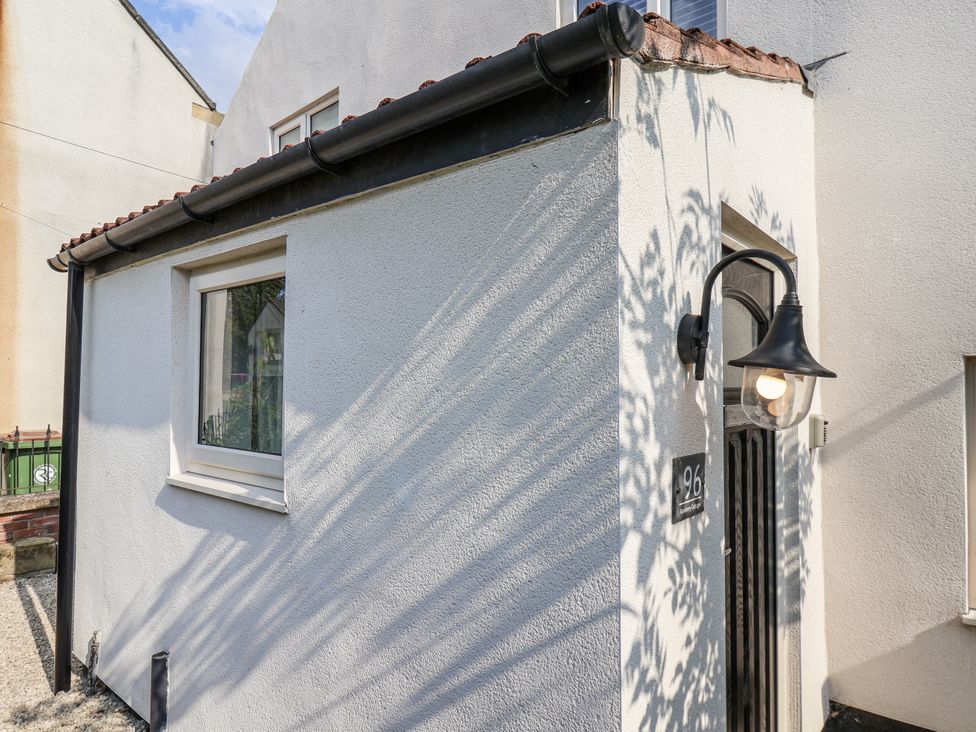 Exterior view of a house with a door and window at 96 Church Street in Guisborough