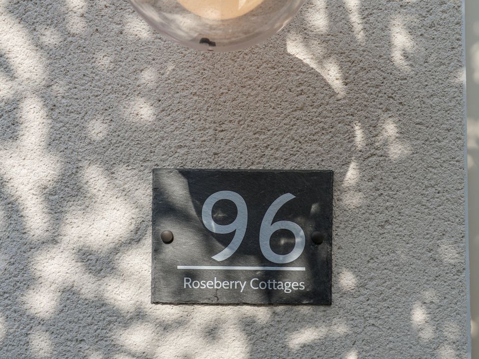 A house sign displaying the number 96 and the name Roseberry Cottages