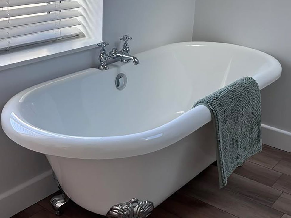 A bathtub with a towel on the side at 96 Church Street in Guisborough