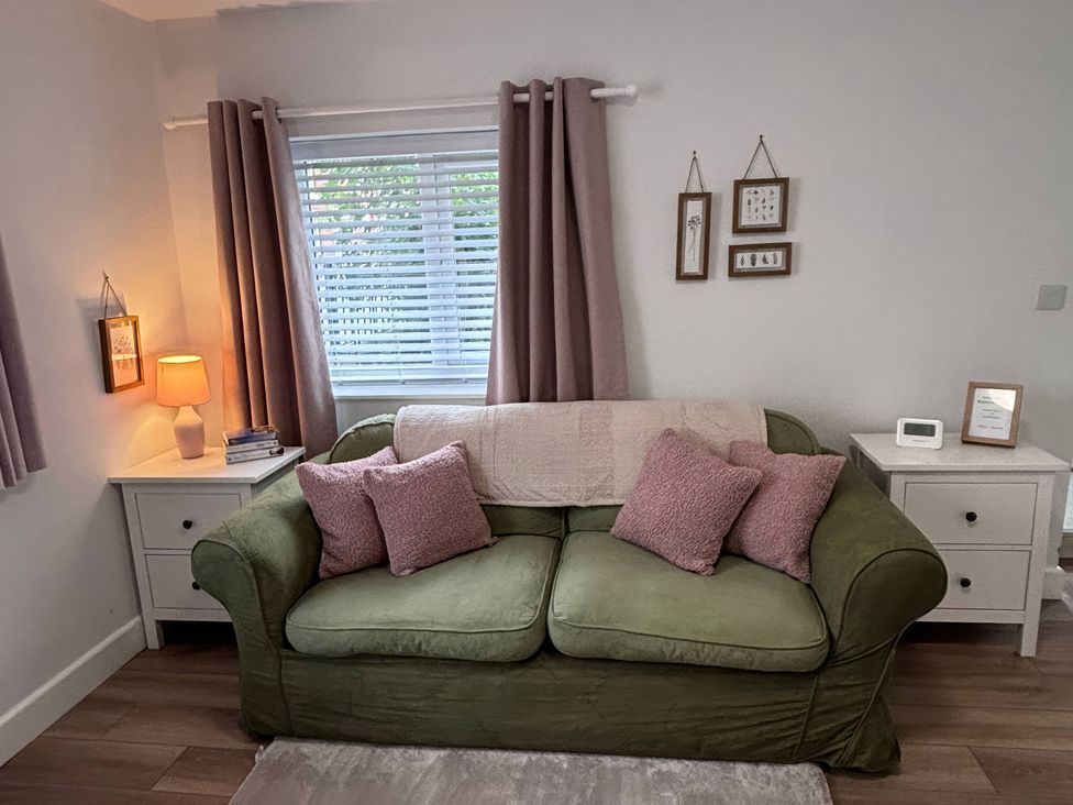 A living room with a sofa and lamp at 96 Church Street in Guisborough
