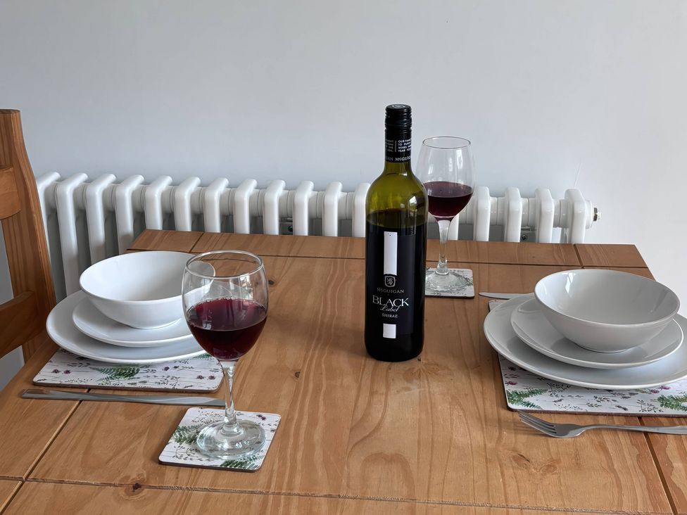 A dining table set with wine and tableware at 96 Church Street, Guisborough