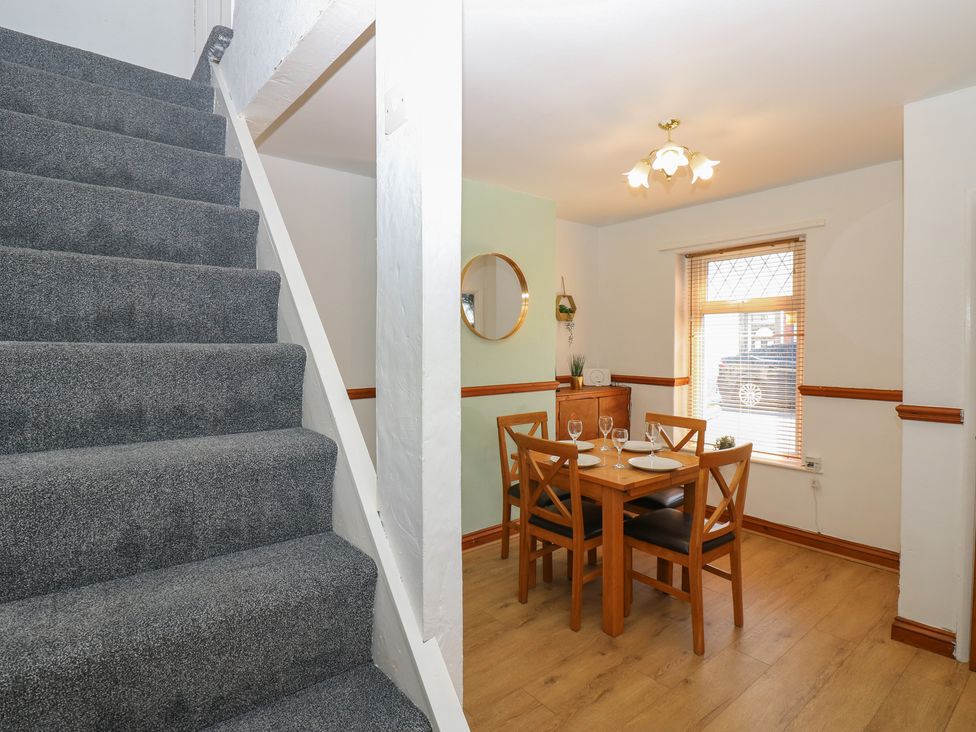 A dining area with table and chairs at Bolton Terrace in Workington