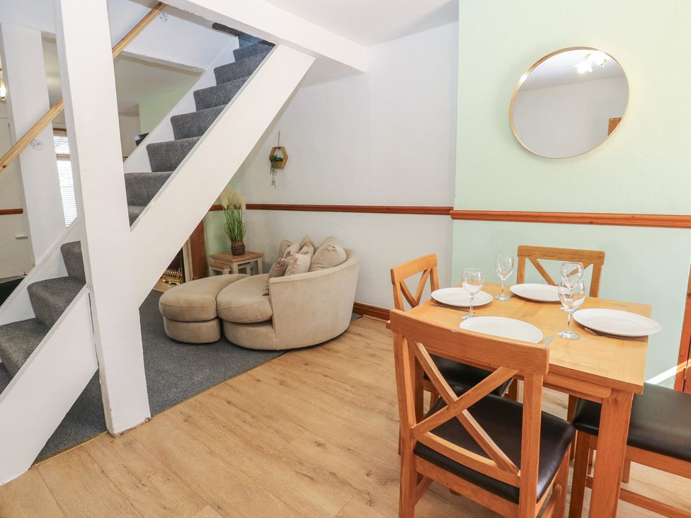 A dining room with a table and chairs at Bolton Terrace in Workington