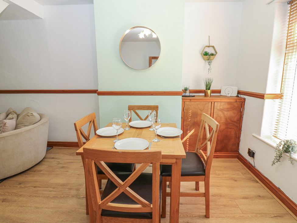 A dining room with a table set for four at Bolton Terrace, Workington