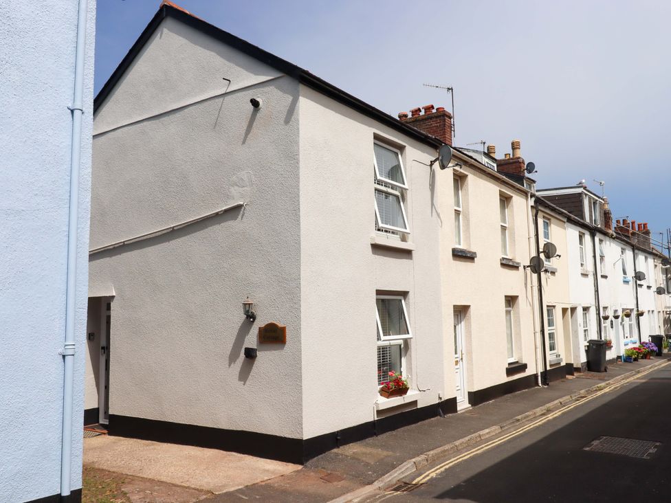 A house exterior with windows and a doorway at Kenny Cottage in Dawlish