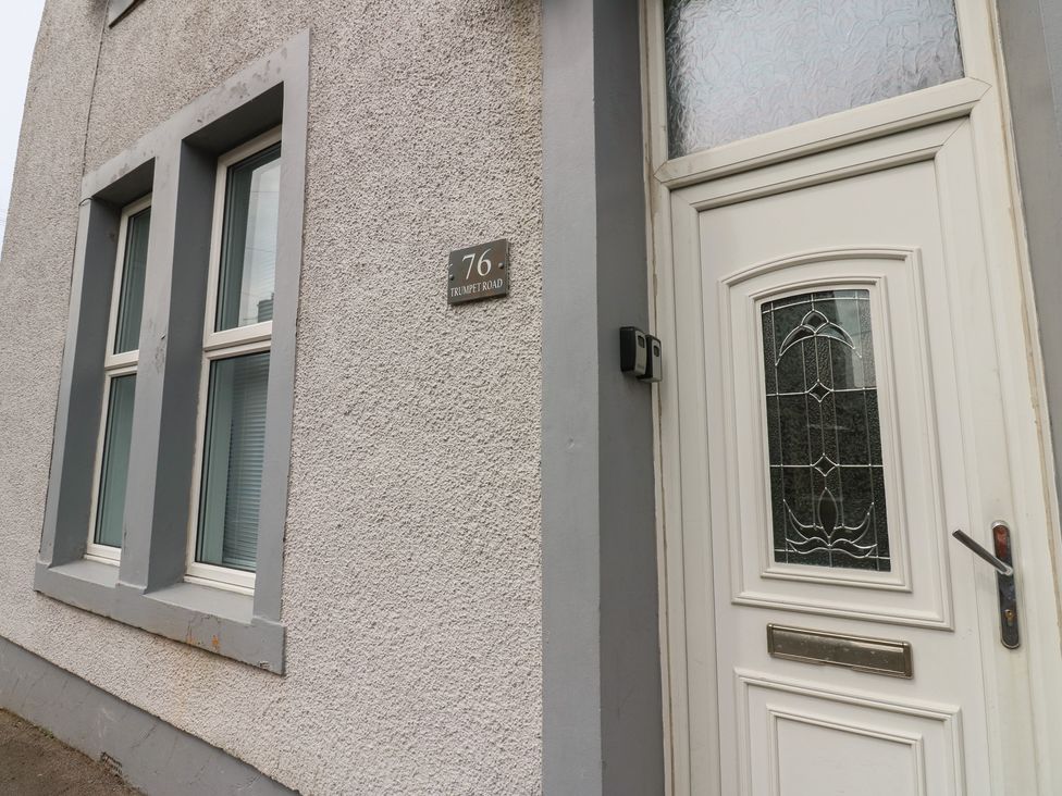 The exterior view of a house with a door and windows at Ennerdale Edge Cleator