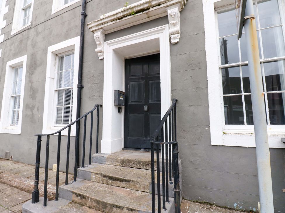 An entrance with steps and railing at Lowther Suite Whitehaven
