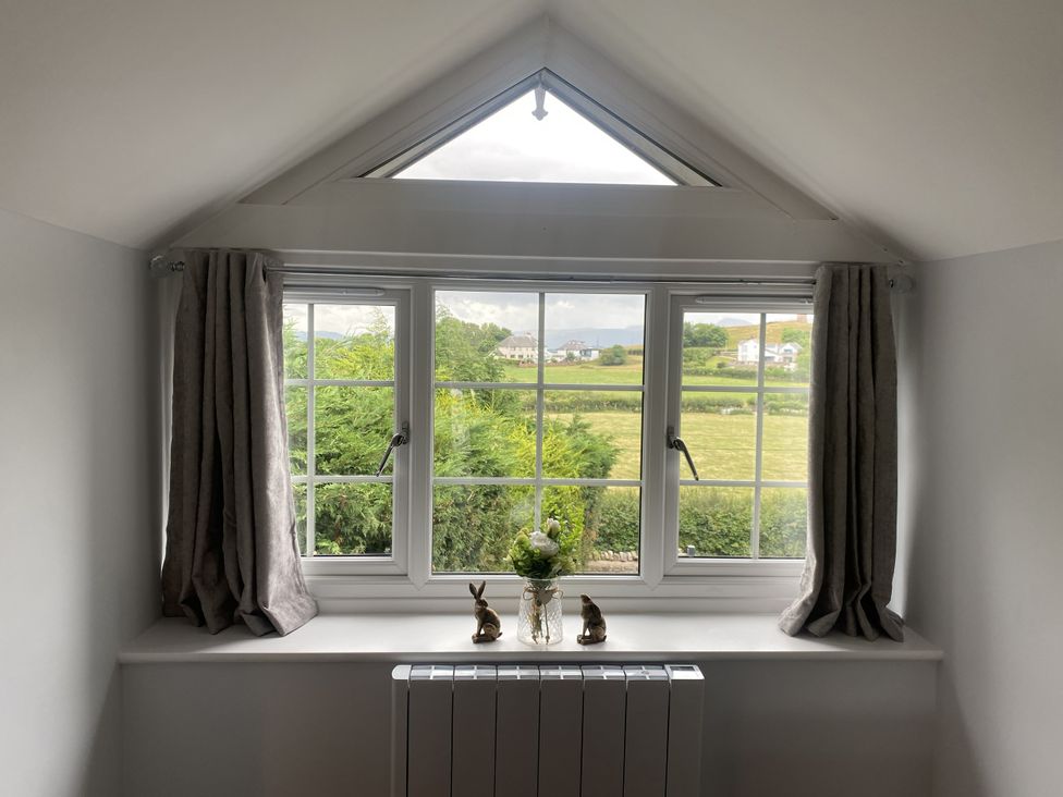 A room with a window and view at The Gatekeepers Cottage - Skerry Vore Bryn Pydew near Llandudno Junction