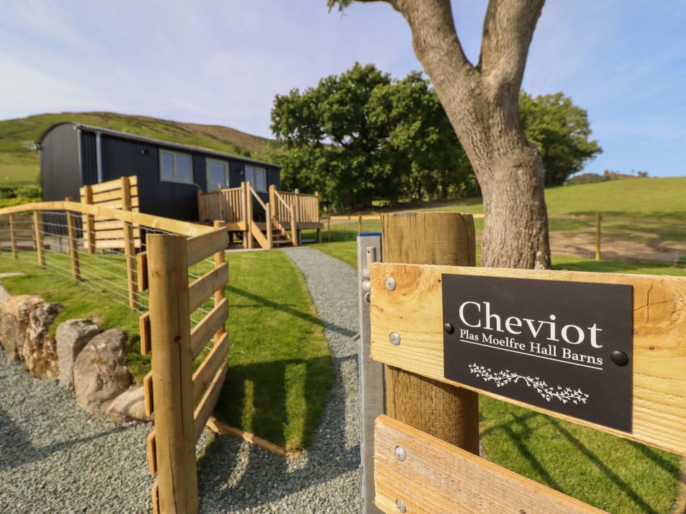 An exterior view of Cheviot property with pathway and fence in Oswestry