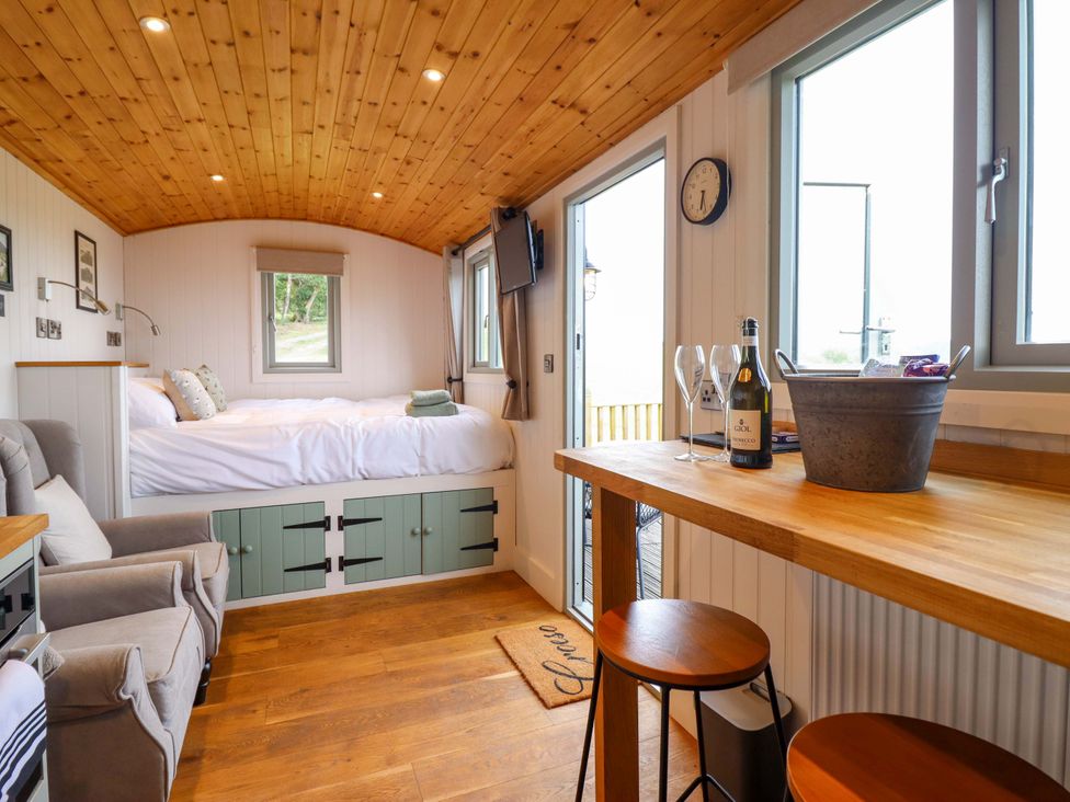 A studio with a bed and seating area at Cheviot in Oswestry