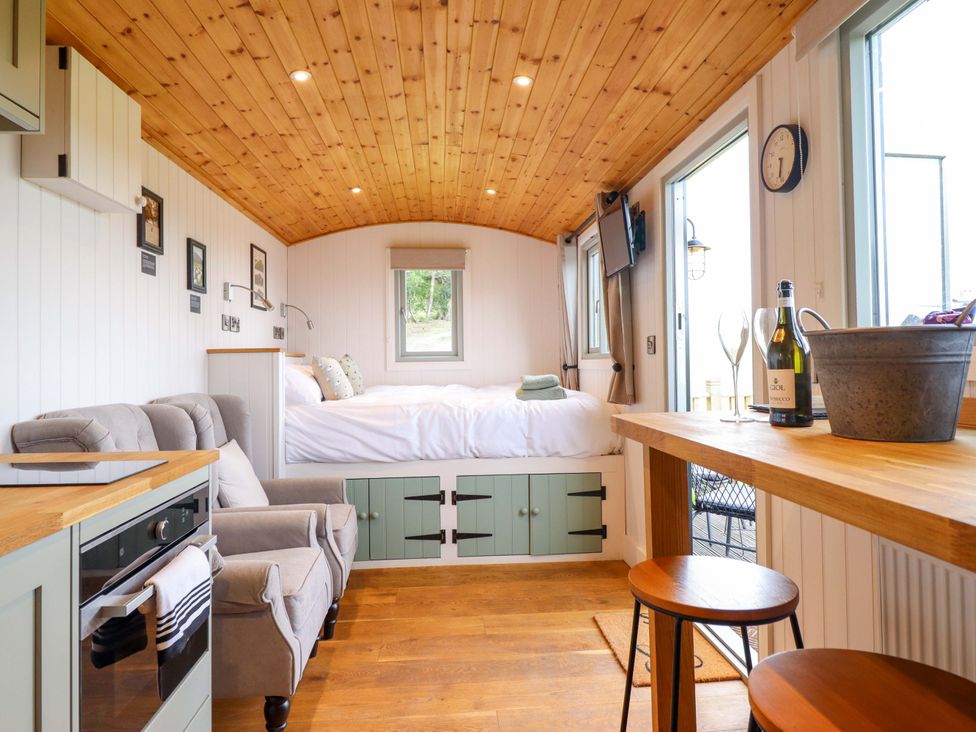 A living room with a sofa and bed at Cheviot in Oswestry