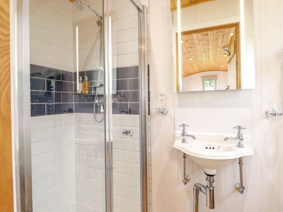 A bathroom featuring a shower and sink at Cheviot in Oswestry
