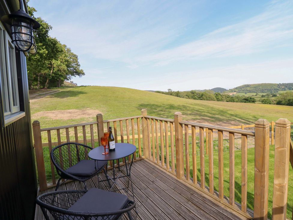An outdoor area with a table and chairs at Cheviot in Oswestry