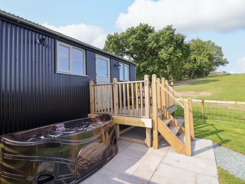 A spa and deck with steps at Cheviot in Oswestry