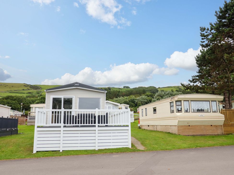 Two caravans with a lawn and hills at 8 Puffin Way Llwyngwril