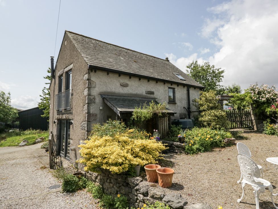 A house with a garden and patio at Treacle in Carnforth