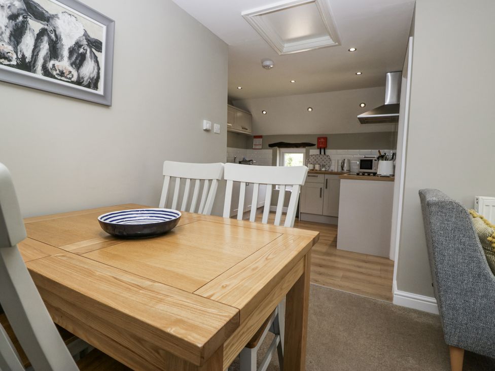 A dining room with a table and bowl at Treacle in Carnforth