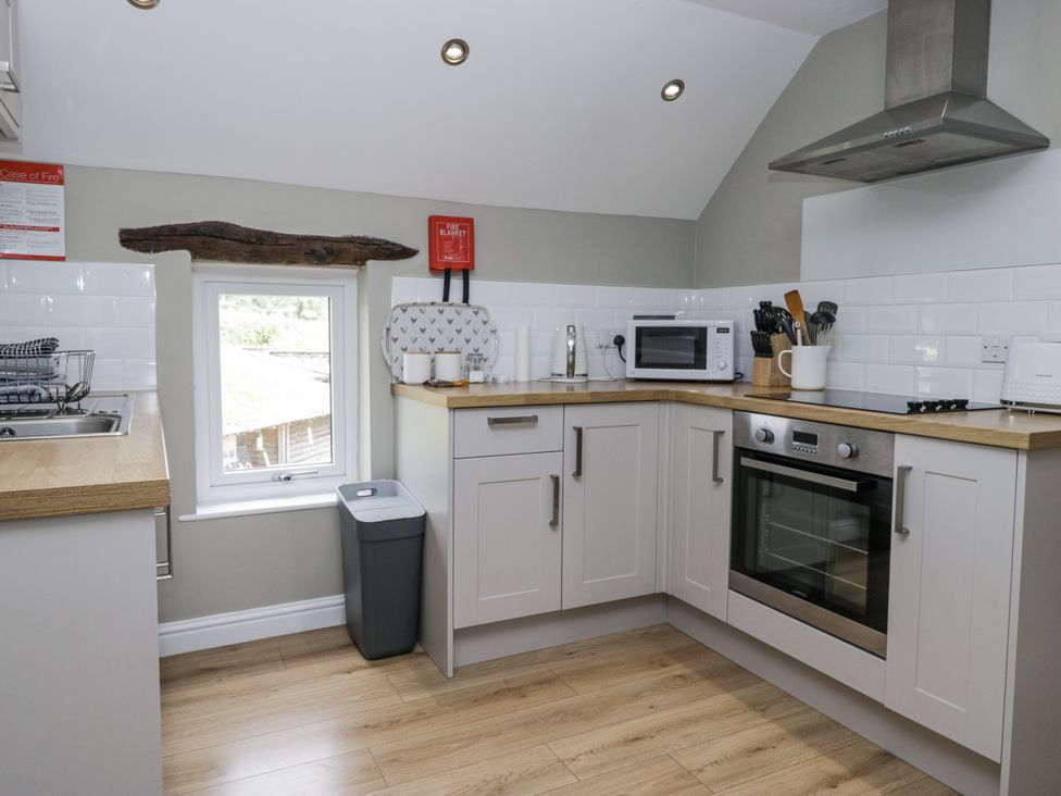 A kitchen with appliances and countertop at Treacle in Carnforth