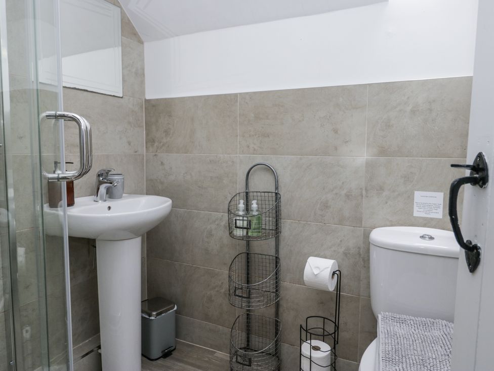 A bathroom with a sink and shower at Treacle in Carnforth