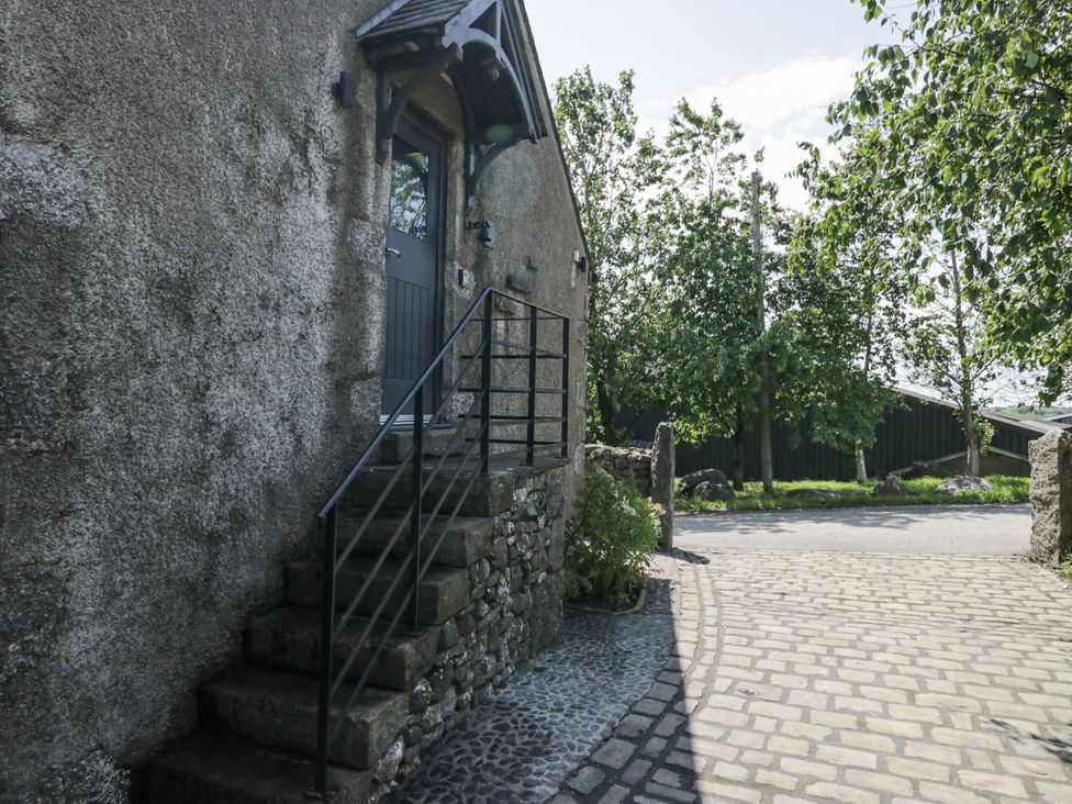 A door with stairs and railing at Treacle in Carnforth
