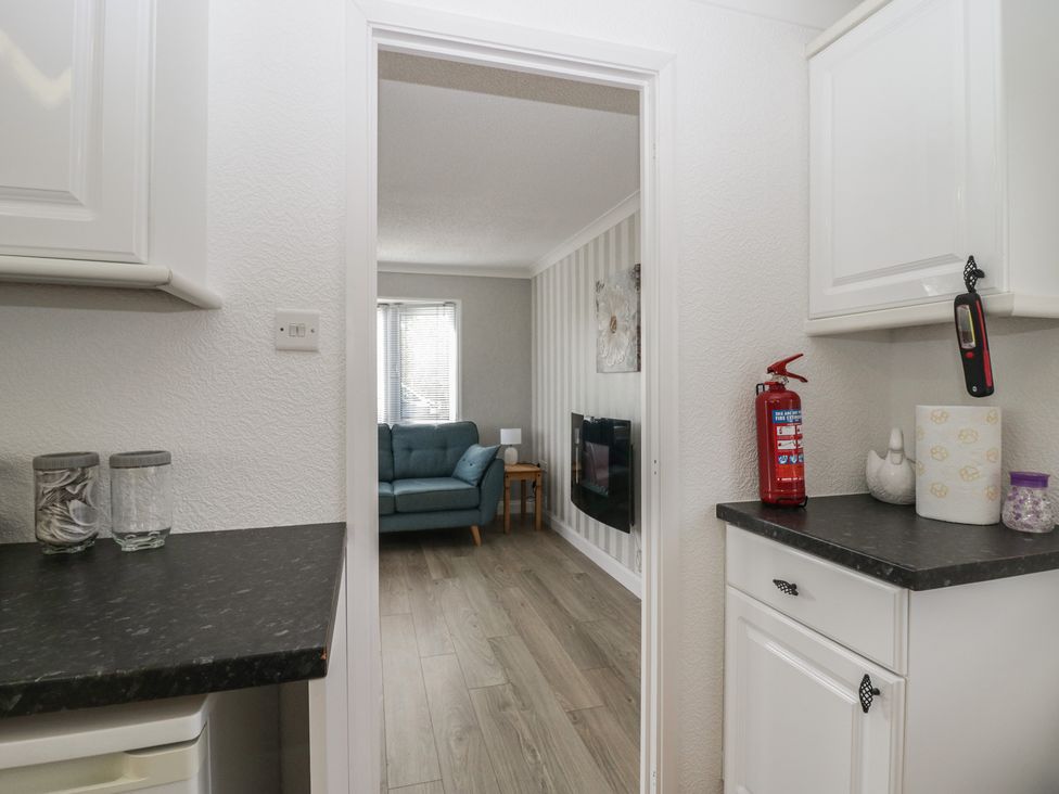 A kitchen looking into a living room at Cherry Tree in Kidlington