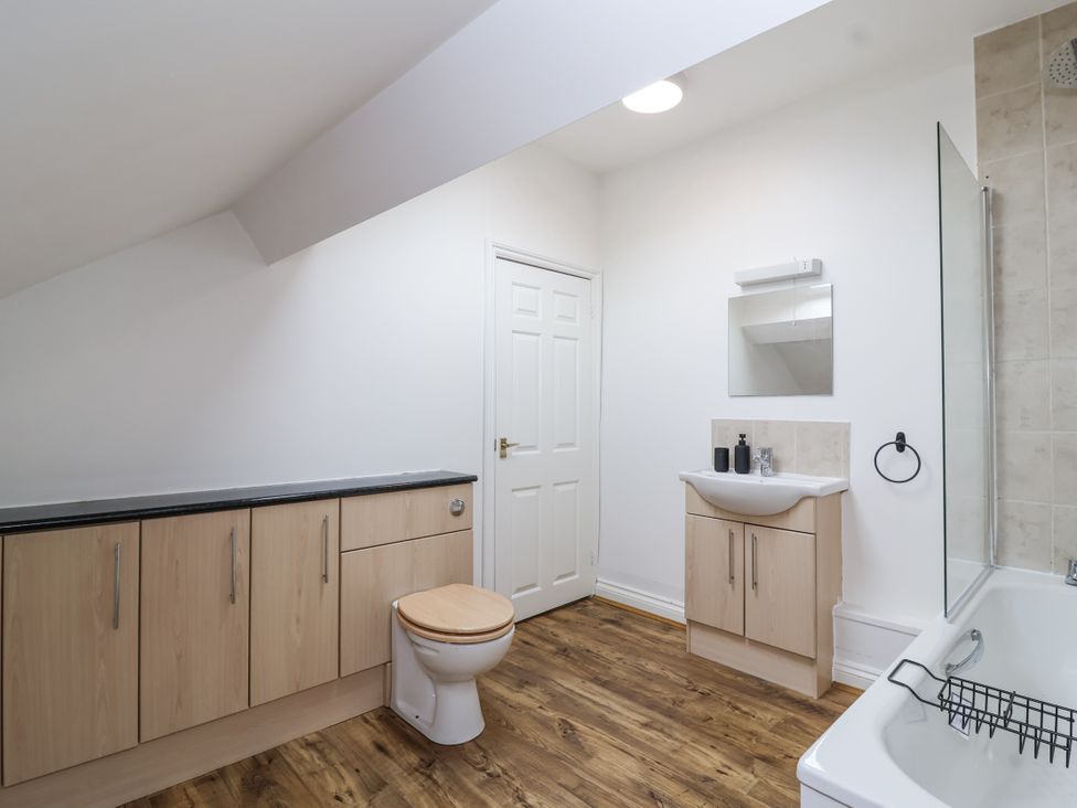 A bathroom with a sink and toilet at The Cottage in Clevedon