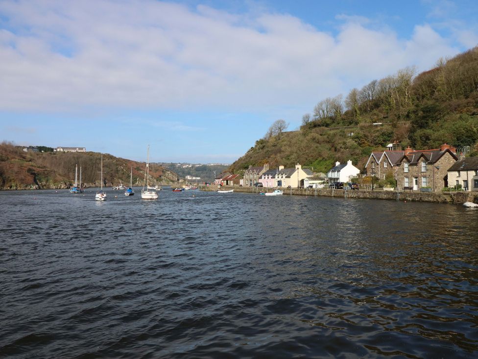 A view of the river with boats and houses along the shore at 18 Main Street