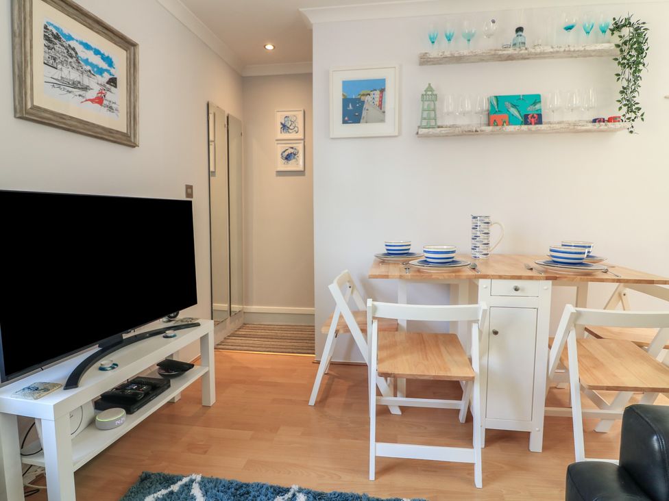A dining room with a table and chairs at The Hideaway 