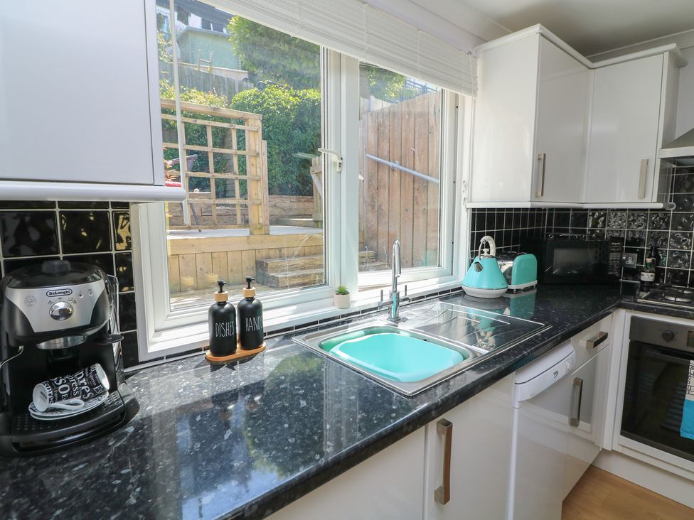 A kitchen with a sink and window at The Hideaway