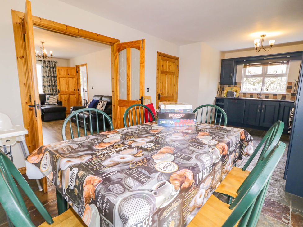 A dining room with a table and chairs at 7 Killybrack Glen Omagh
