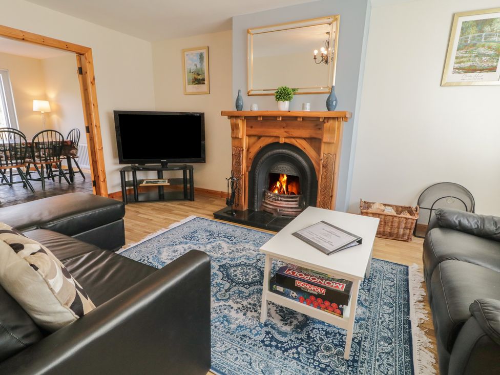 A living room with a television and fireplace at The Sperrin Getaway in Omagh