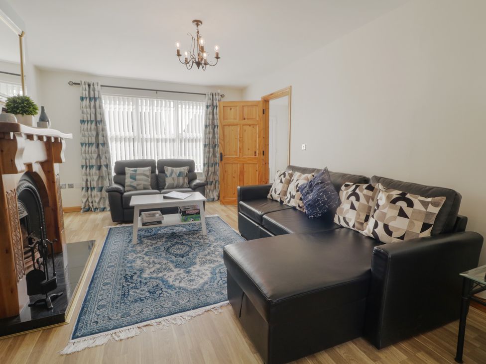 A living room with a sofa and coffee table at The Sperrin Getaway in Omagh