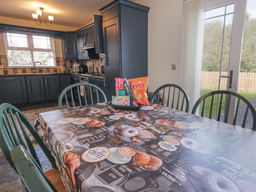 A dining room with a table and chairs at The Sperrin Getaway in Omagh