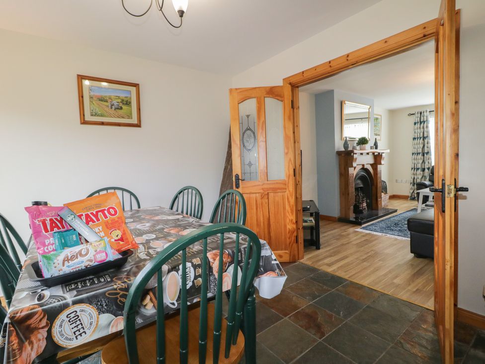 A dining room with a table and chairs at The Sperrin Getaway in Omagh
