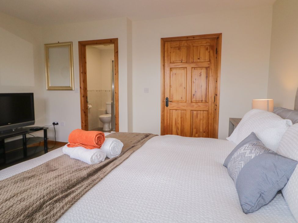 A bedroom with a bed and television at The Sperrin Getaway in Omagh