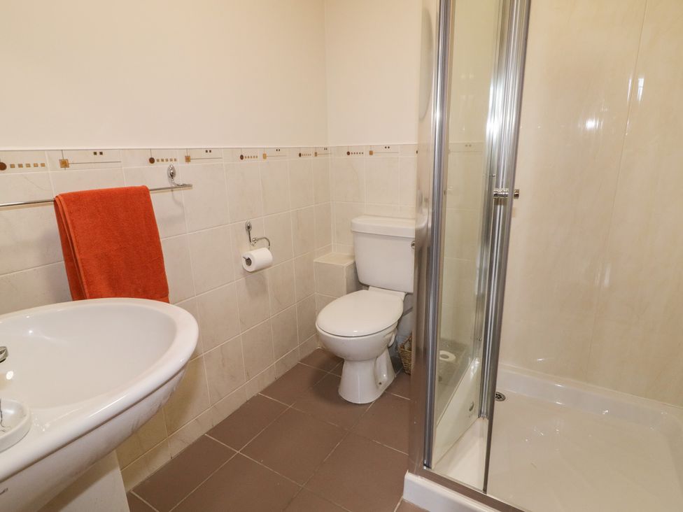 A bathroom with a shower and sink at The Sperrin Getaway in Omagh