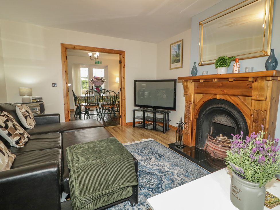 A living room with a sofa and television at The Sperrin Getaway in Omagh