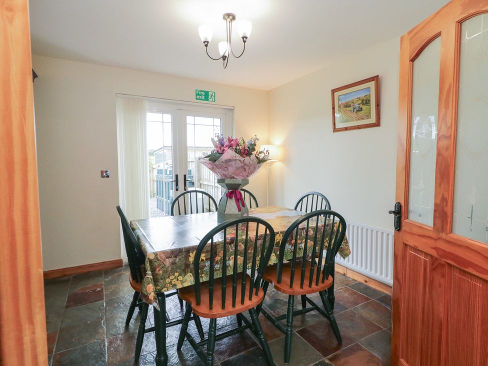 A dining room with a table and chairs at The Sperrin Getaway in Omagh