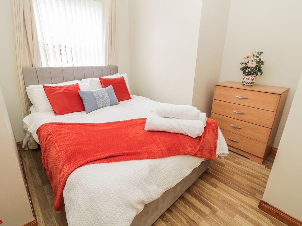 A bedroom with a bed and a dresser at The Sperrin Getaway in Omagh
