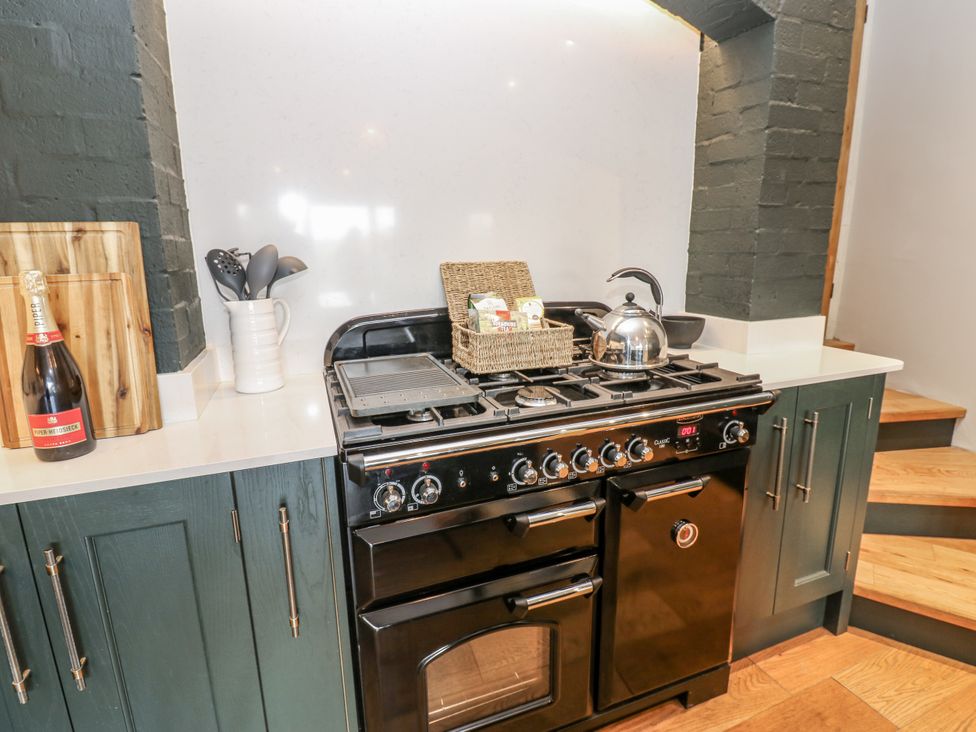 A kitchen with a stovetop oven and various kitchenware at 26 Frenchgate in Richmond