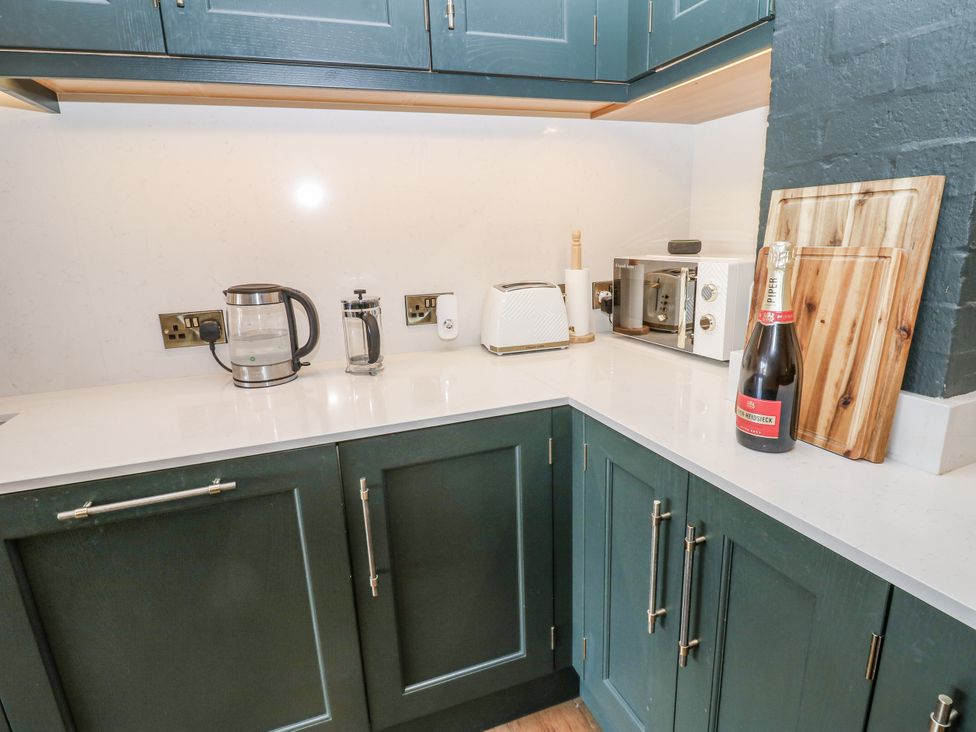 A kitchen with appliances including a kettle and toaster at 26 Frenchgate in Richmond