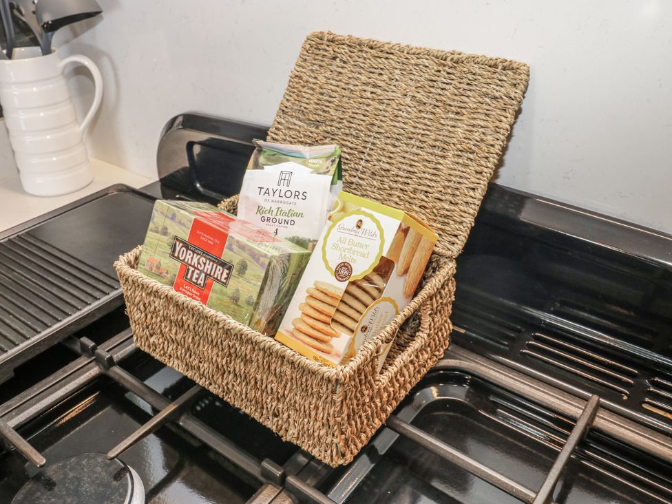 A basket containing tea and biscuits on a stove at 26 Frenchgate, Richmond