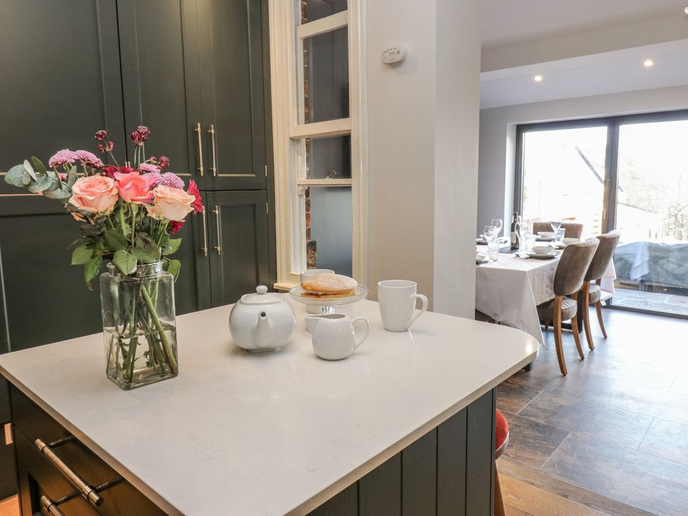 A kitchen with flowers on the counter at 26 Frenchgate in Richmond