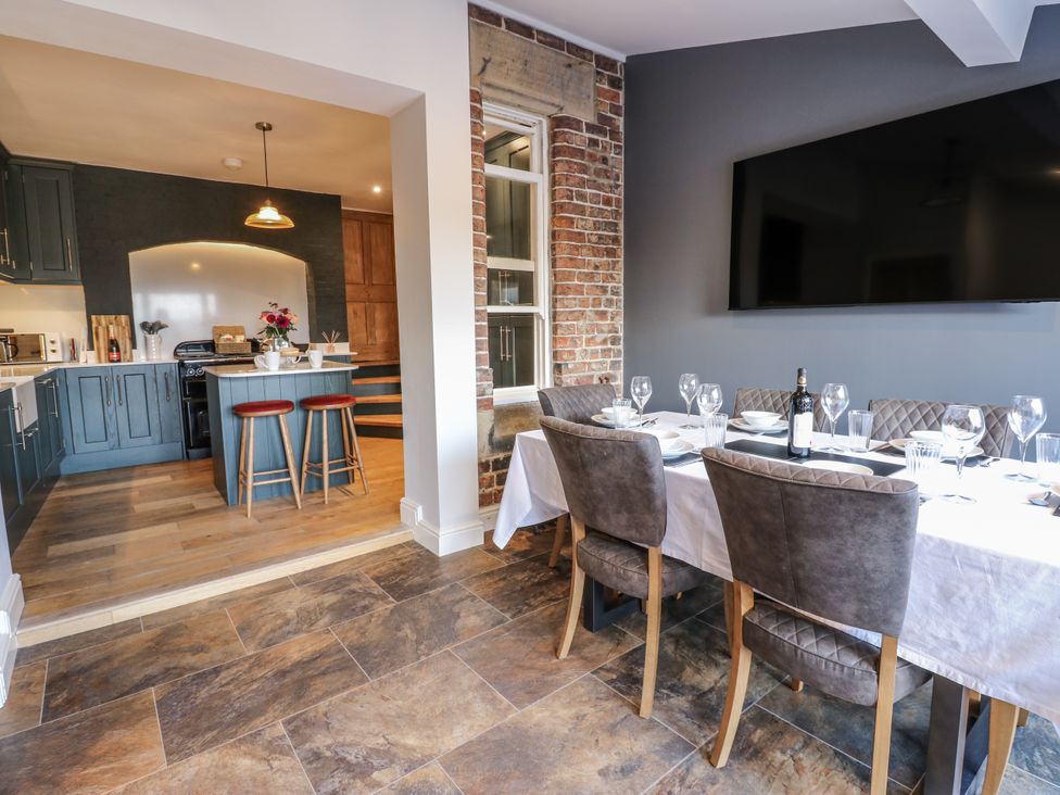 A dining room with a table set for a meal at 26 Frenchgate in Richmond