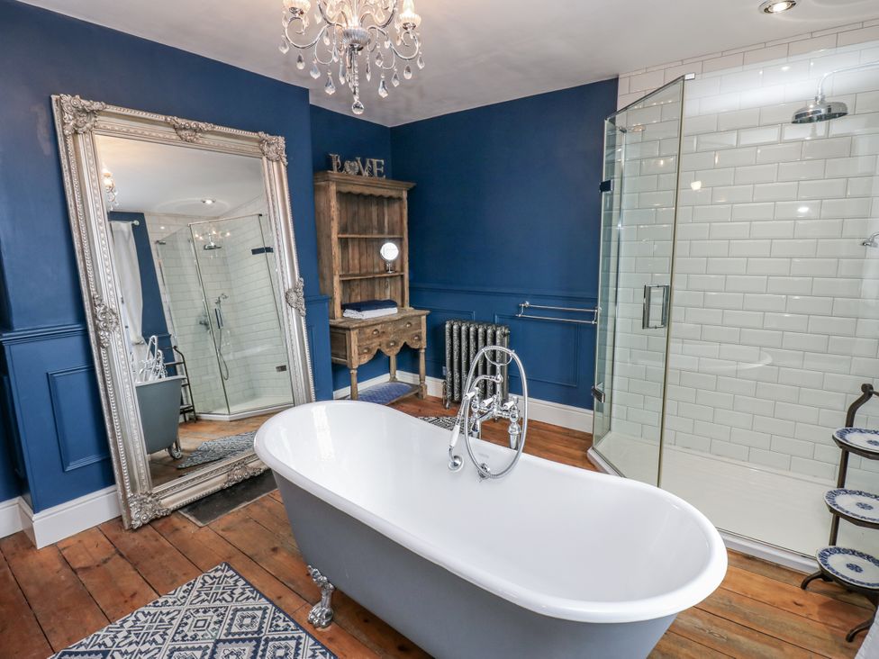 A bathroom with a bathtub and shower area at 26 Frenchgate in Richmond