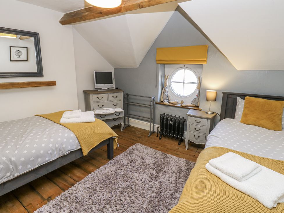 A bedroom with two beds and a window at 26 Frenchgate in Richmond