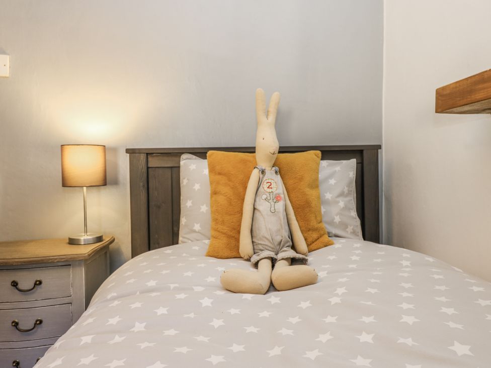 A bedroom with a bed and a soft toy at 26 Frenchgate in Richmond