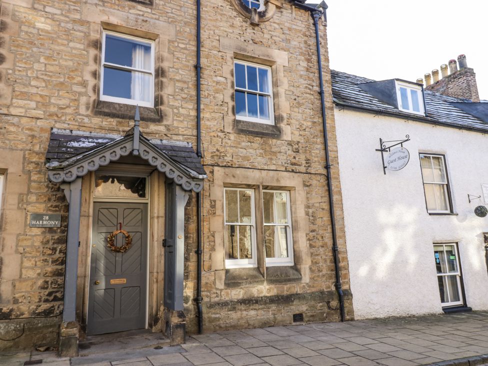 A building exterior with a door and windows at 28 Harmony in Richmond
